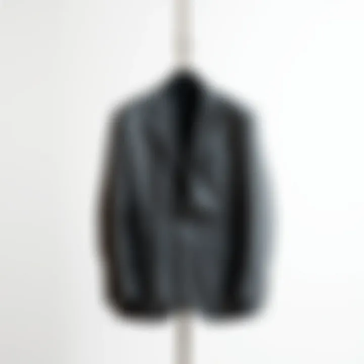 A sophisticated gray sport jacket on a stylish hanger against a minimalist background