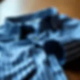 Stylish blue striped shirt on a wooden surface